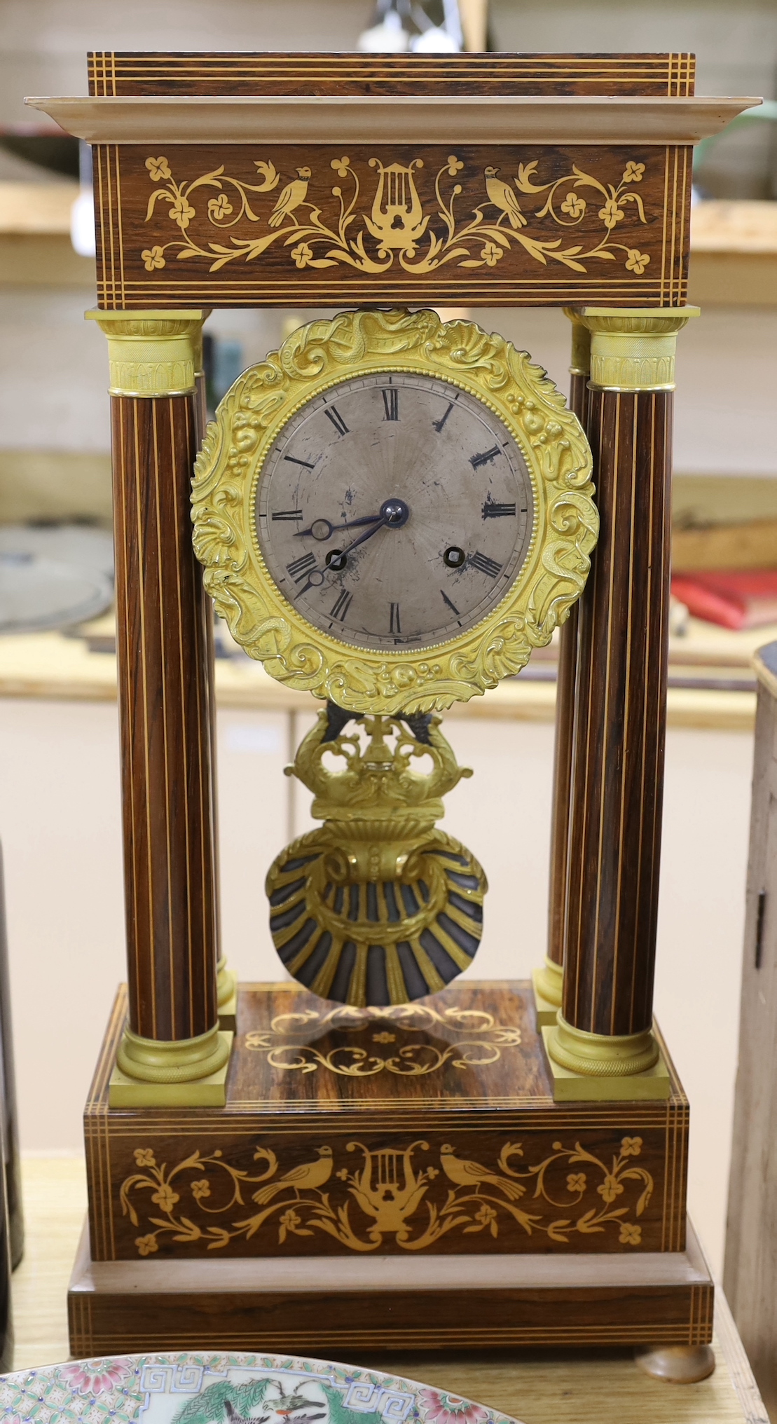 A French Charles X inlaid portico clock, 25.5cm wide, 52cm high